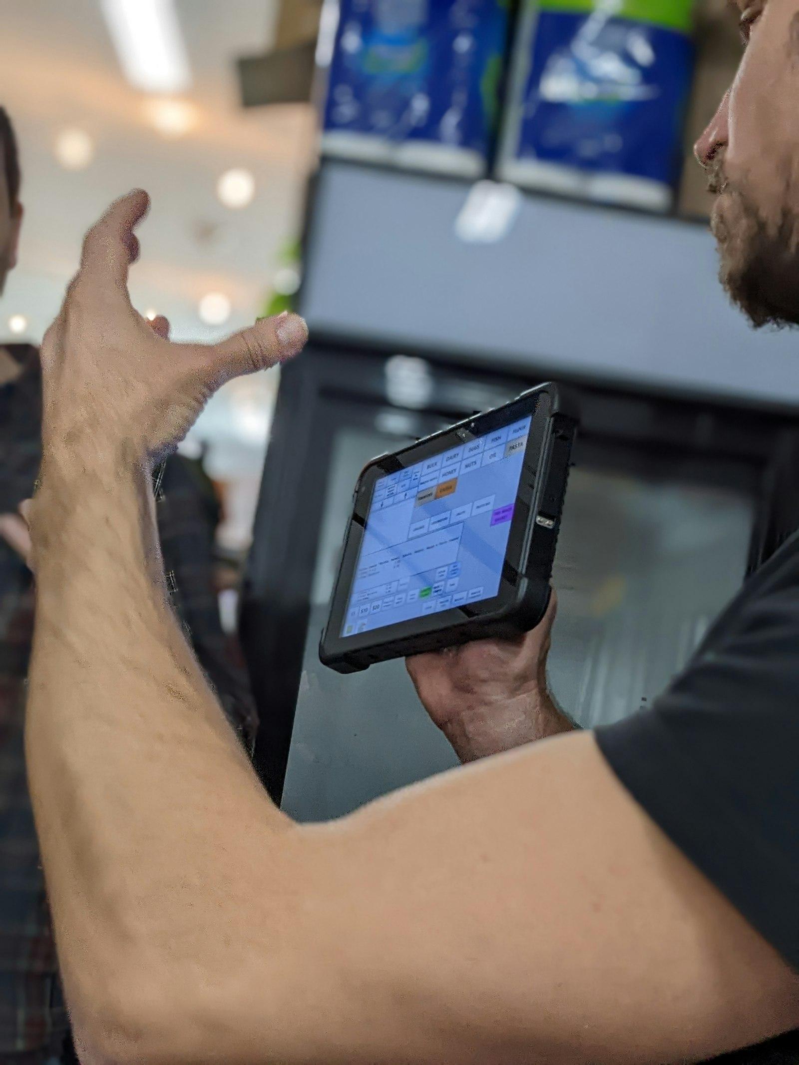 Person holding a rugged tablet